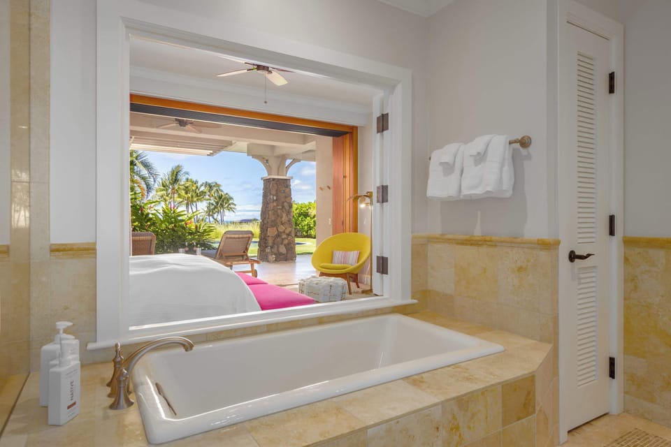The guest bedroom #1 has a lovely on-suite.  Separate tub and shower, double vanity and views into the room and outside from the tub if you choose.