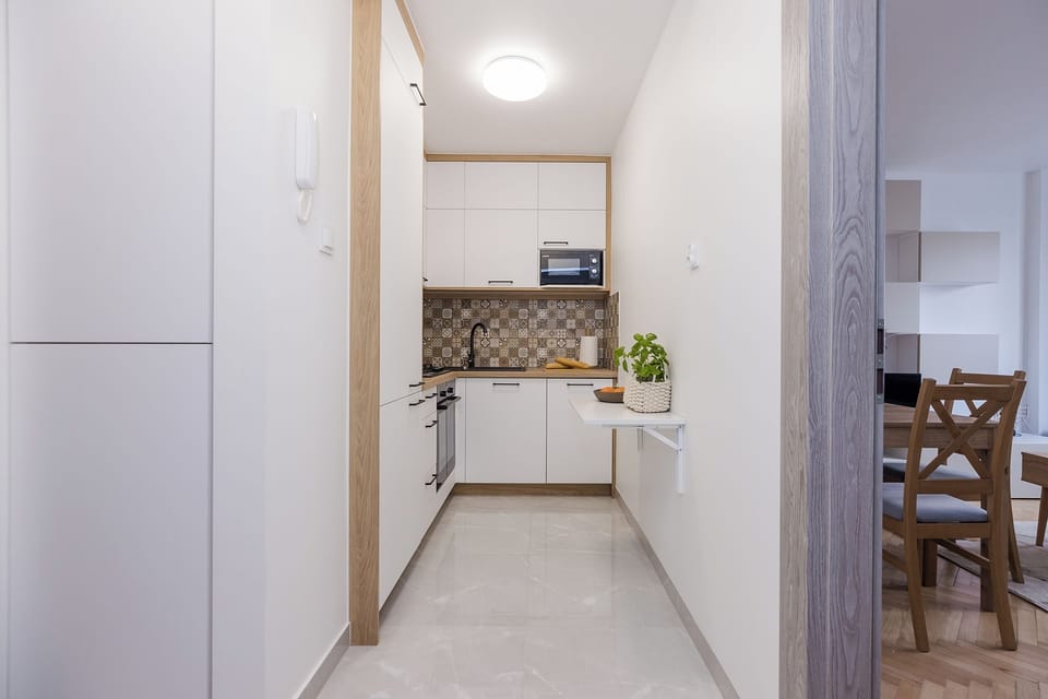 Classic Apartment, Balcony, City View | Private kitchen | Electric kettle
