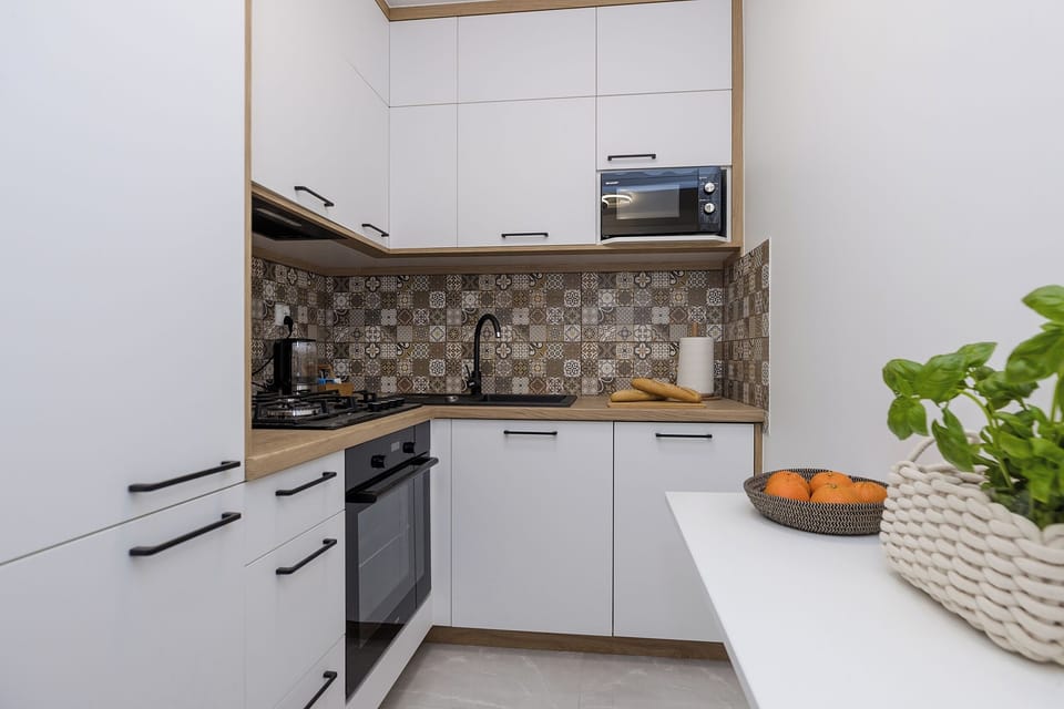 Classic Apartment, Balcony, City View | Private kitchen | Electric kettle