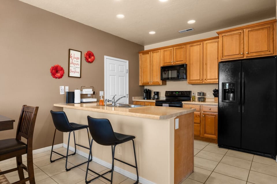 Full kitchen with bar seating.