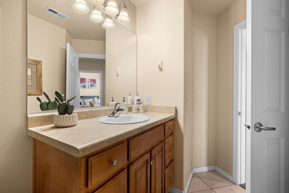 Full, guest bathroom is stocked with shampoo, conditioner, body wash, lotion, and more.