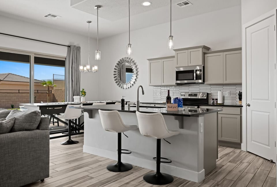 Bar seating and kitchen.