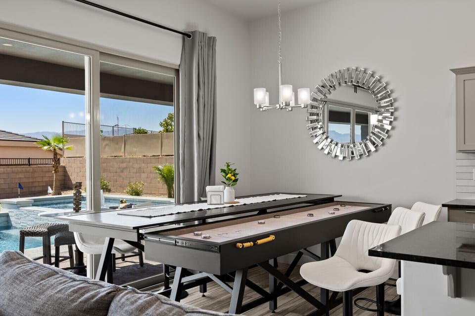 Indoor/outdoor living at it`s best.  Shuffle board under dining table for loads of fun.