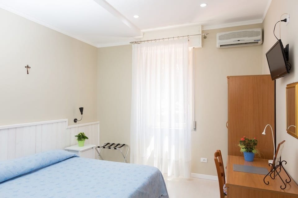 In-room safe, desk, laptop workspace, bed sheets