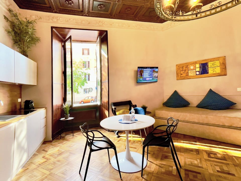Family Studio Suite | Living area | 800-cm Smart TV with digital channels