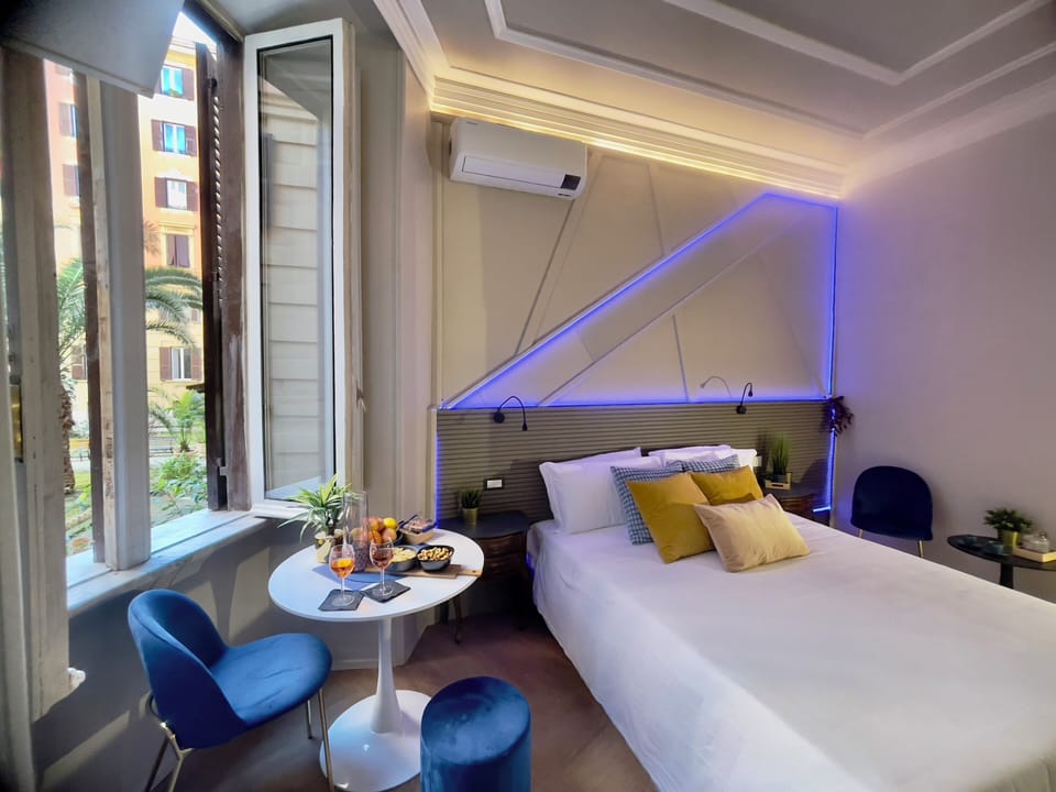 Deluxe Double Room | Minibar, desk, laptop workspace, iron/ironing board