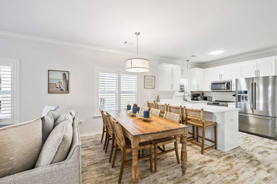 Your open-concept living space flows seamlessly from cozy seating to dining table, creating the perfect setting for memorable meals together.