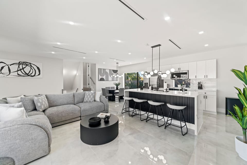 This living room features a harmonious blend of crisp white walls.