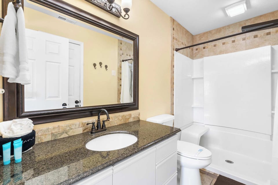 Wash up in the king ensuite, offering a single vanity & shower