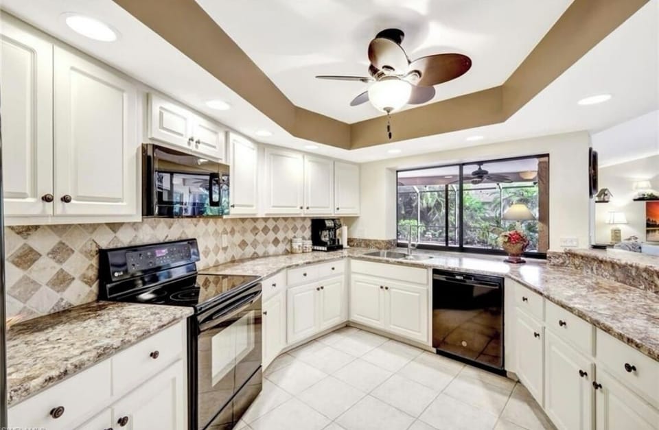 Kitchen open to lanai and family room.