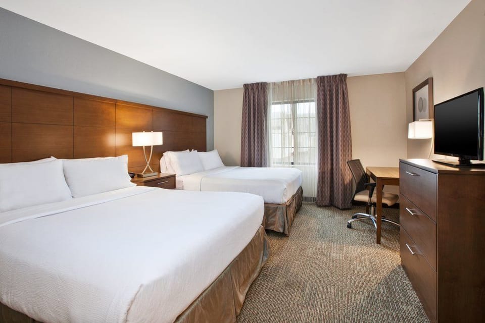 Enjoy the spacious layout with two comfortable queen beds, perfect for unwinding after a day of exploring.