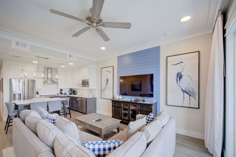  A comfortable and stylish living space that opens up to a dining area, perfect for social evenings.