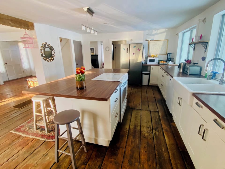 Cook, chat, and connect - spacious kitchen with a large island flows seamlessly into dining area for effortless entertaining