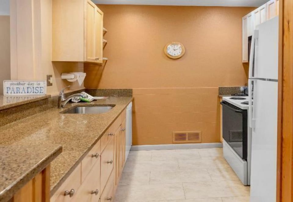 Galley-style kitchen maximizes function and style.