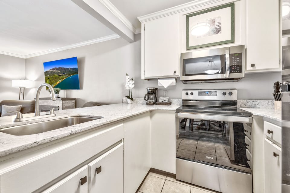 A bright and functional kitchen with modern touches, offering the perfect space to prepare delicious meals in a home-like setting.