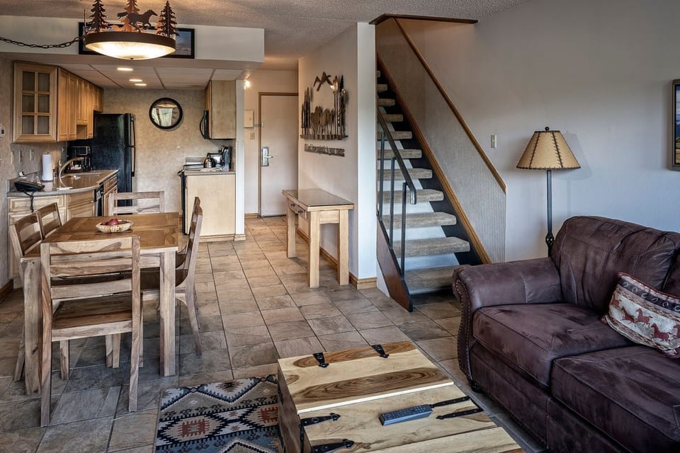 Enjoy meals together in the open dining area with cozy lounge seating.