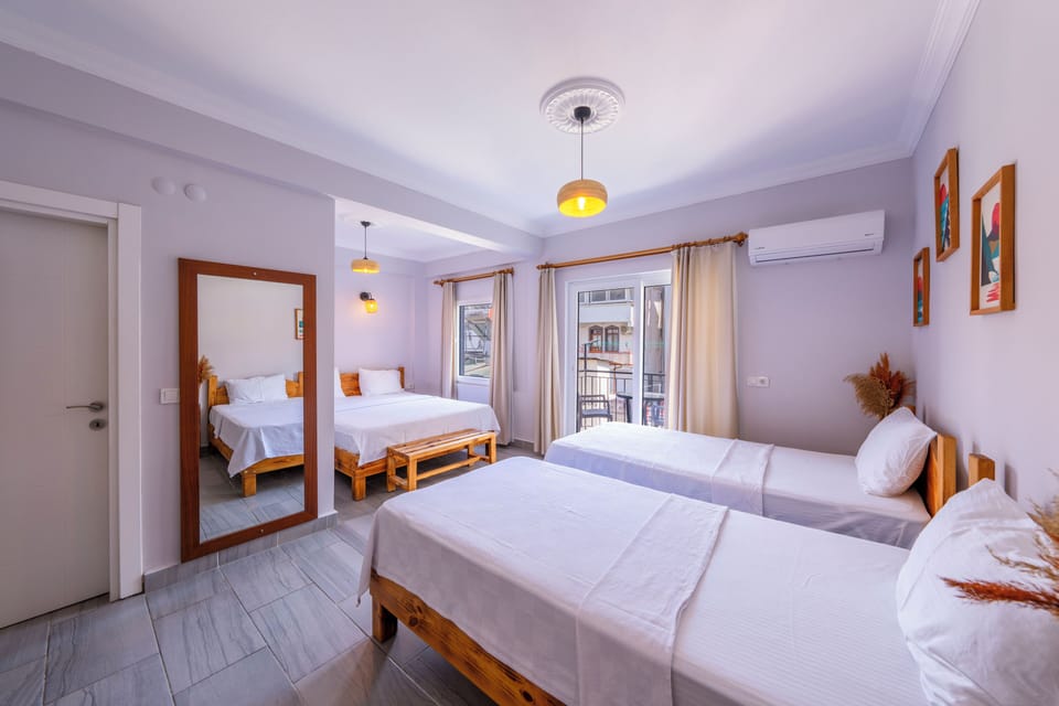Family Quadruple Room, City View | Premium bedding, laptop workspace, iron/ironing board, free WiFi
