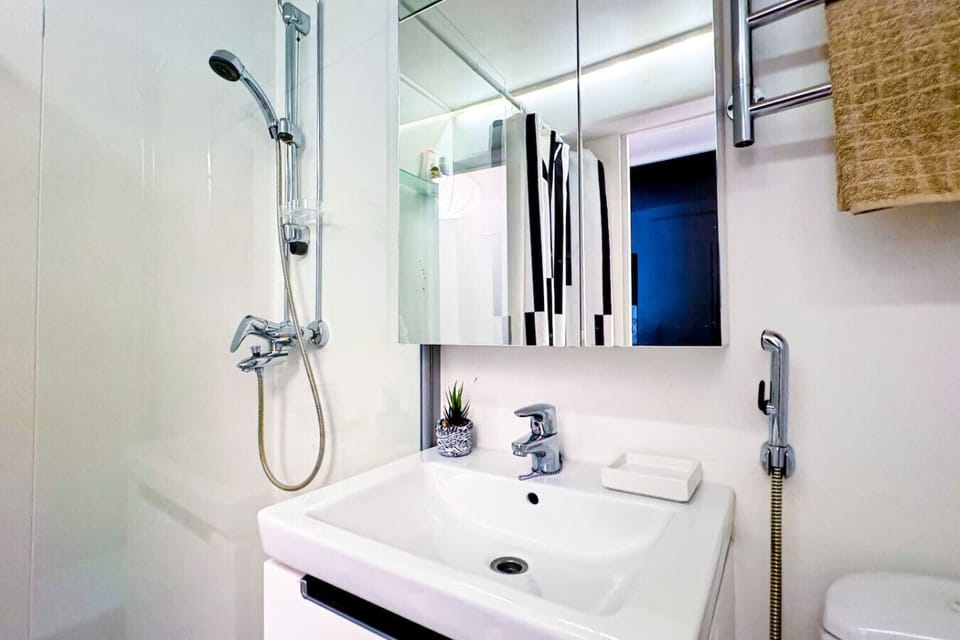 Get ready with ease—well-lit mirror & storage provided.