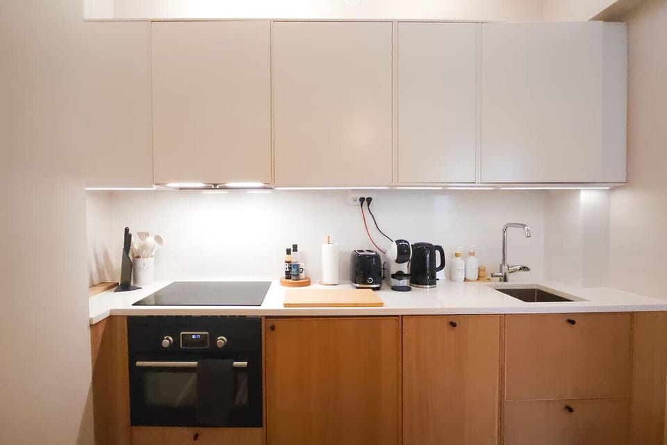 Cook, dine, and unwind in this cozy, simple kitchen with all the essentials for your stay.
