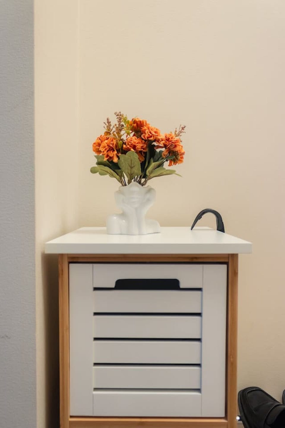 A tastefully decorated hallway adds a warm, welcoming vibe as you enter the apartment.
