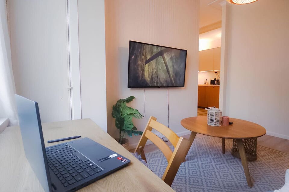 Get productive in this cozy, well-lit workspace, perfect for work or study.