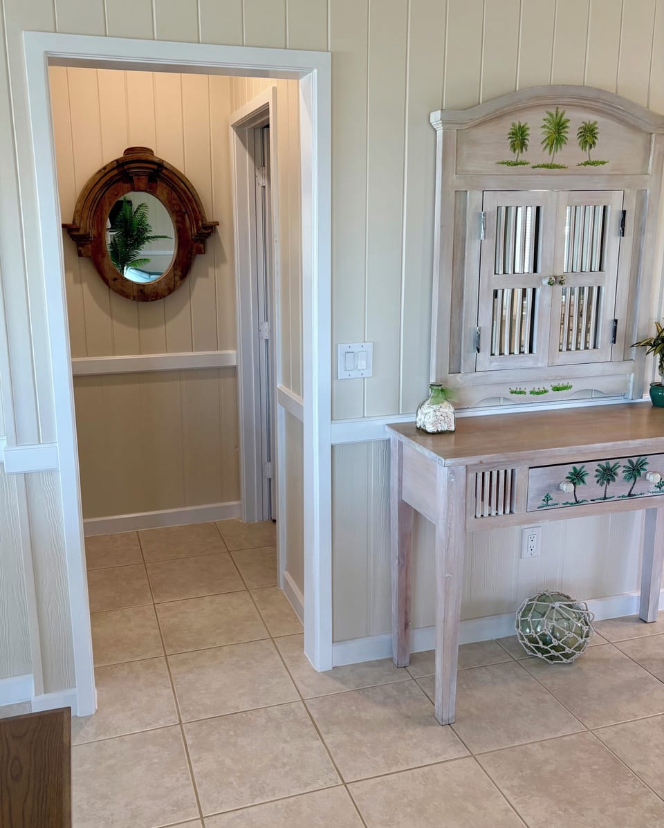 Half Bath located on upper level off living area.