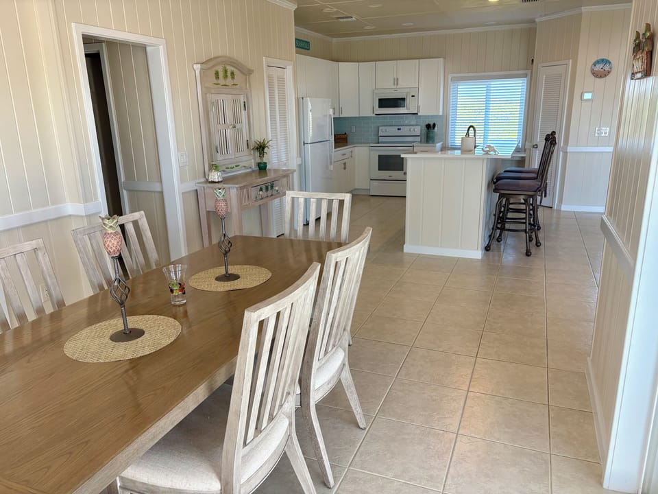 Spacious dining room, kitchen and breakfast bar.