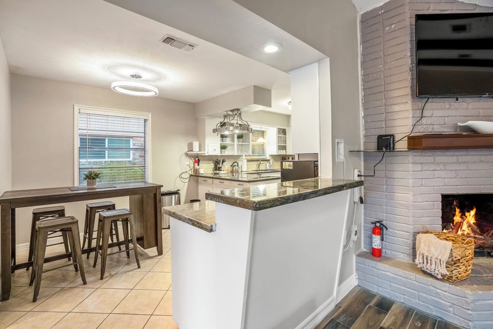Bright kitchen space perfect for preparing meals and gathering together.