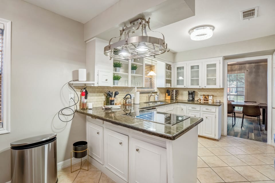 Spacious kitchen featuring modern amenities and a welcoming atmosphere.