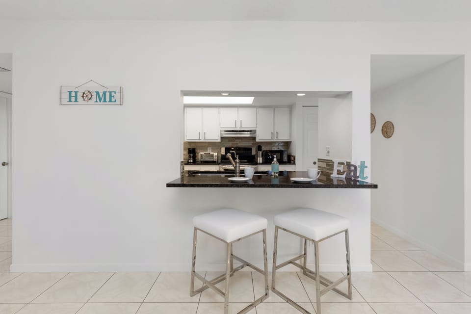 Streamlined kitchen counter with modern finishes and task lighting