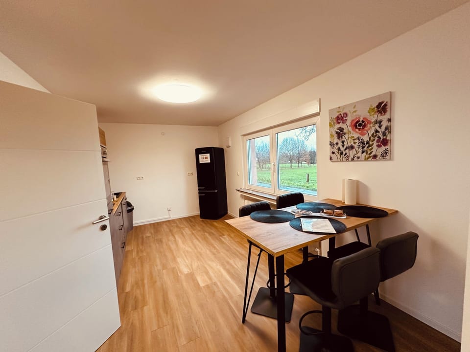 Spacious living and dining area in a modern style. (2)