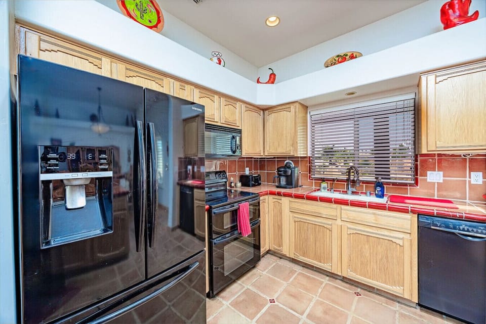 Spacious, well-stocked kitchen perfect for preparing family meals or hosting friends.