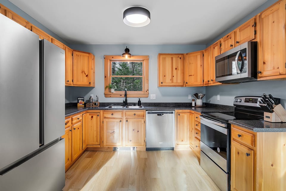 Fully stocked kitchen, stainless steel appliances, and dishwasher