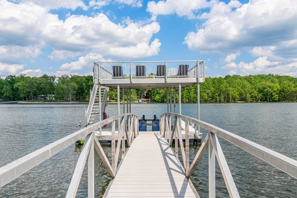 Your double decker dock with 4 lounge chairs, slip, 1 kayak, and there are 2 tables to sit around on the landing