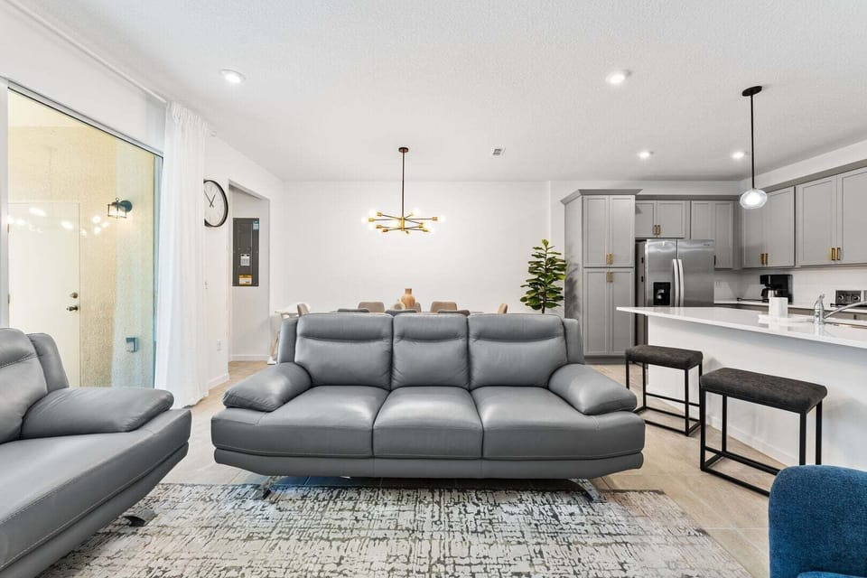 Enjoy a movie night in our cozy living room, complete with a large-screen TV and comfortable plush seating.