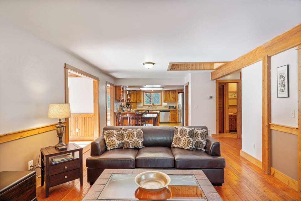 Cozy living area with leather sofa and decorative fireplace