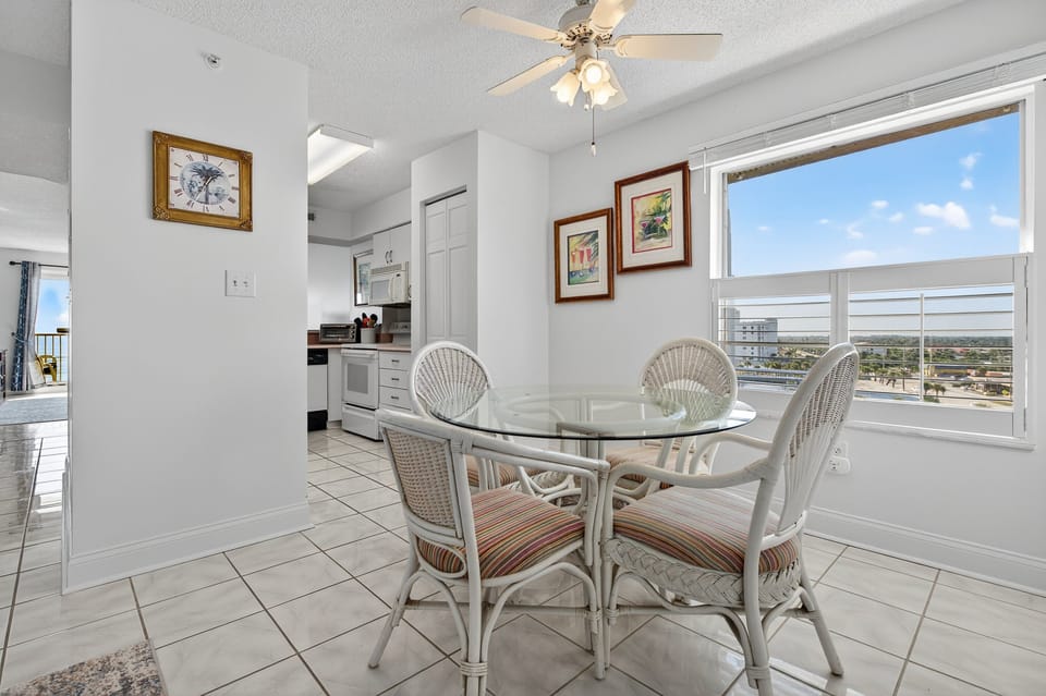 Enjoy ocean views with every meal! This Ormond Beach condo features dining room seating for four overlooking the Atlantic