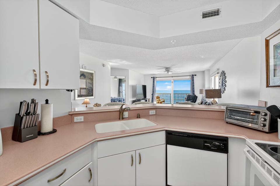 The fully equipped kitchen offers everything you need, plus a stunning ocean backdrop