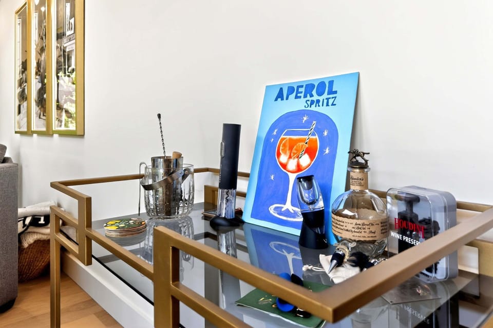 The bar cart in the living room is stocked with mixology essentials to help you craft the perfect cocktail.