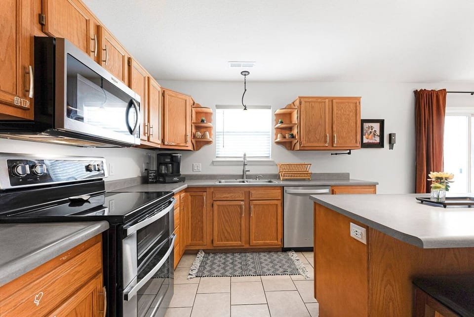 Prep meals with ease in this fully equipped kitchen, stocked with modern appliances and a starter package of essentials before heading out to Promenade Park.