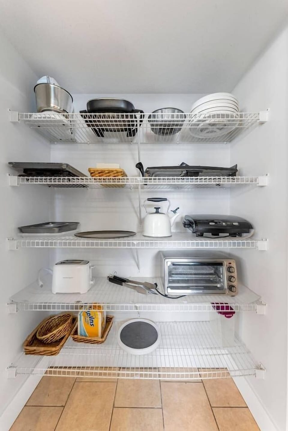 Our well-stocked pantry shelves feature handy small appliances like a toaster and griddle, perfect for whipping up big family breakfasts.