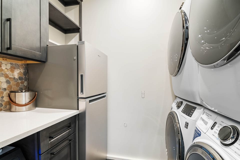 Laundry, gear drop, and a cozy corner for the pups—everything’s got its place.