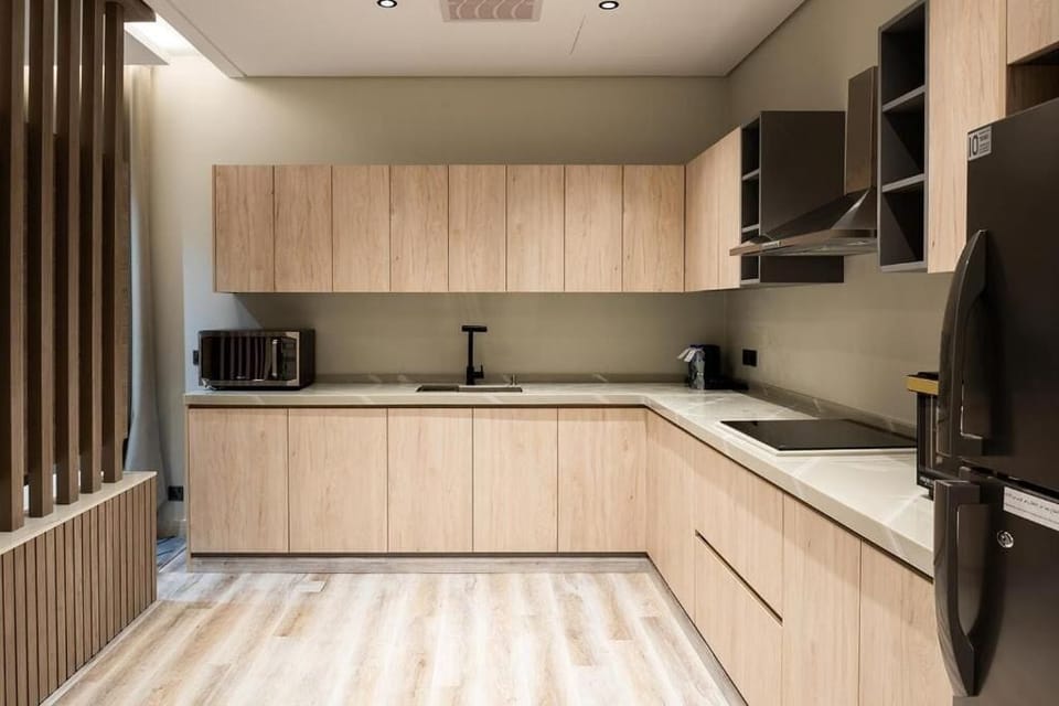 Three-Bedroom Apartment | Private kitchen | Fridge, microwave, oven, stovetop
