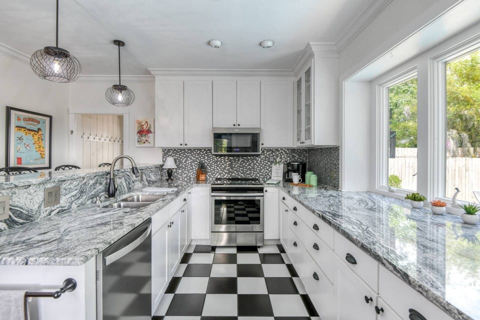 The beautifully updated kitchen features modern appliance, vast counterspace, and all the tools you need to prepare your favorite foods and drinks.