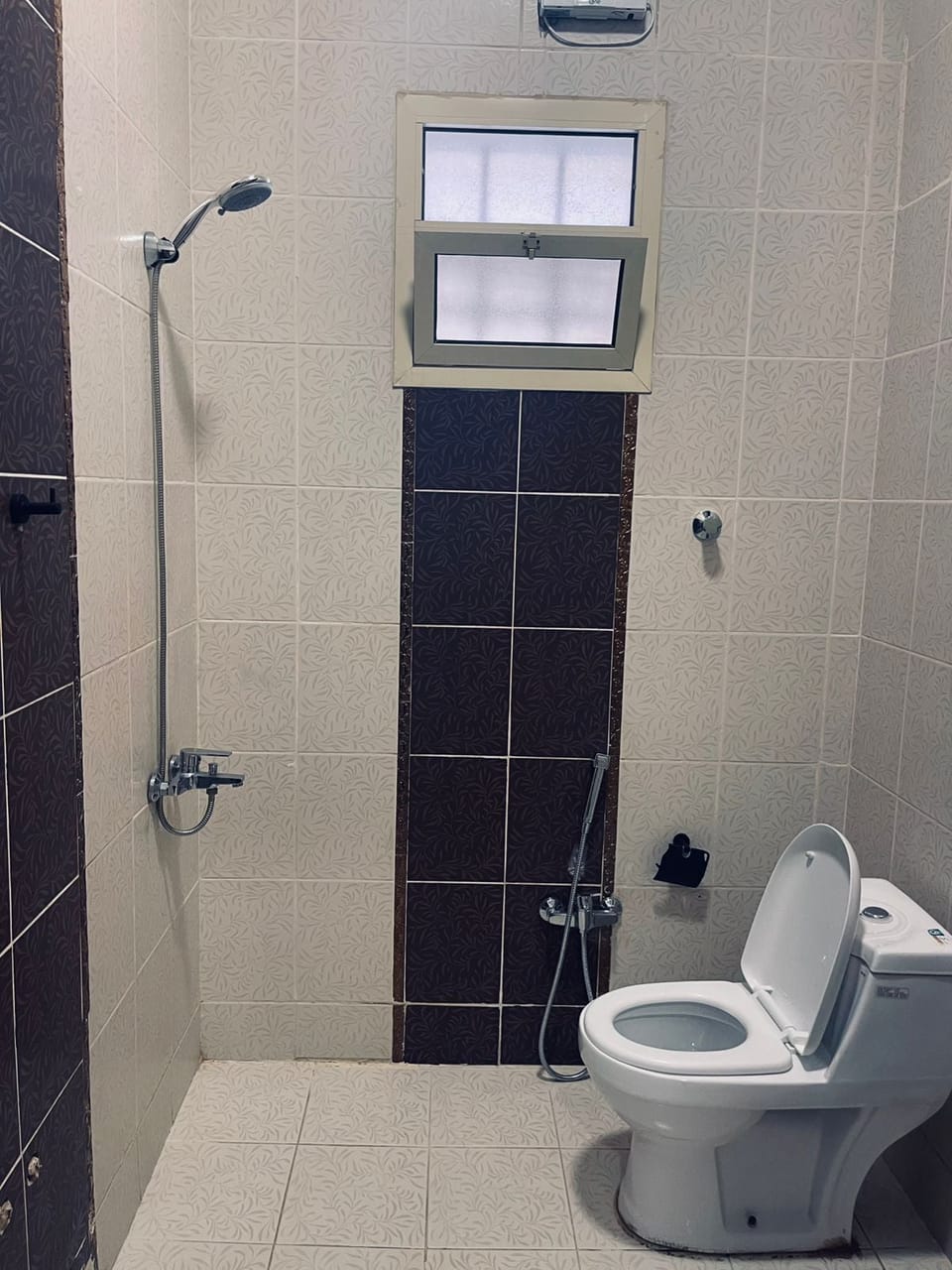 Basic Apartment | Bathroom | Shower, hair dryer, slippers, soap
