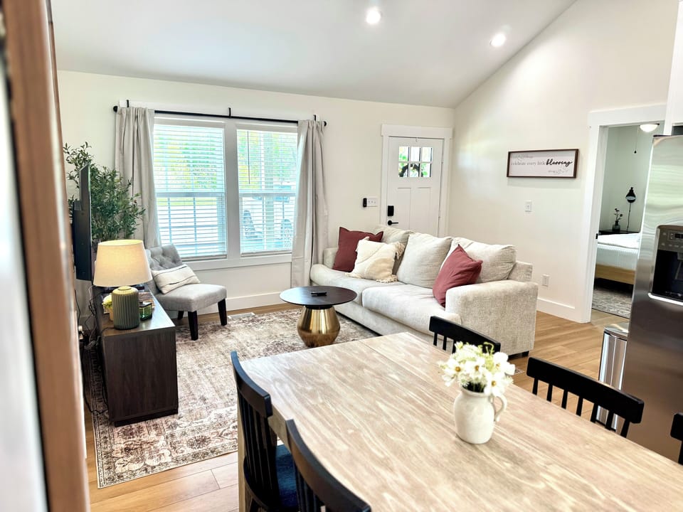 🛋️ Welcome & Entertain
The living room greets you as you walk in, connected to the dining area and kitchen — perfect for relaxing, chatting, or enjoying your favorite shows and games with fast streaming while others cook or dine.
