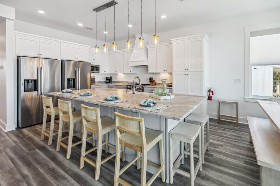 Cook together in your spacious gourmet kitchen featuring granite counters, stainless appliances, and stylish pendant lighting over the breakfast bar.