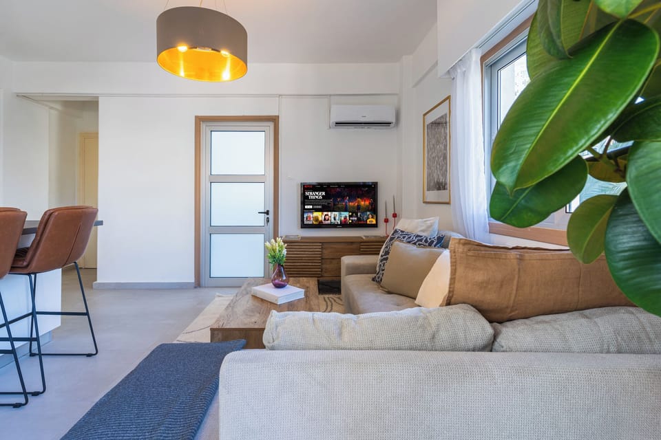 Deluxe Apartment, 1 Queen Bed with Sofa bed, Non Smoking, City View | Living area | Flat-screen TV