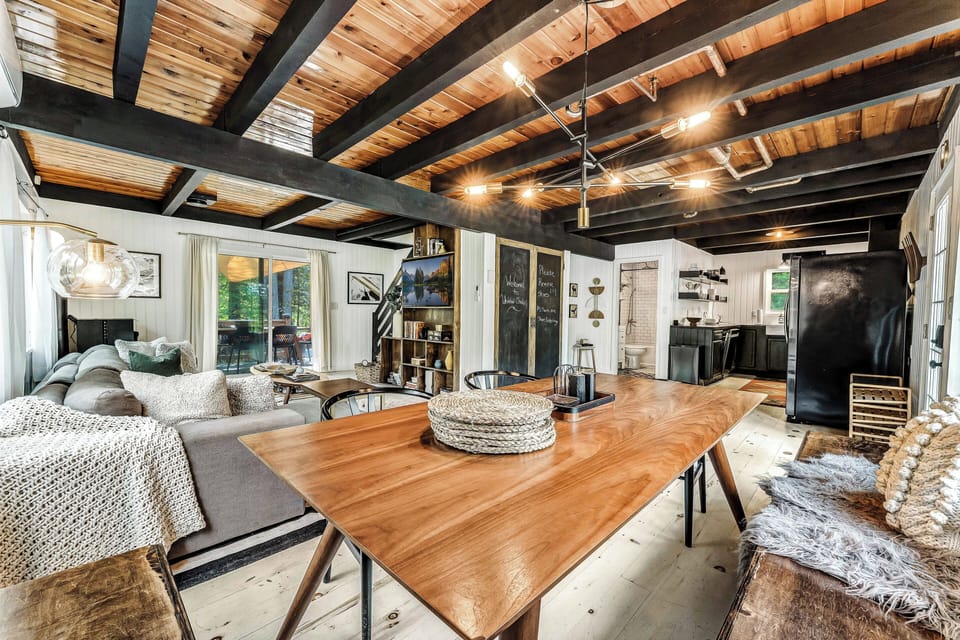 Welcome to our bright and spacious open-concept living room, where comfort meets style and flows seamlessly into the dining area and kitchen — the ideal space for gathering and creating lasting memories!