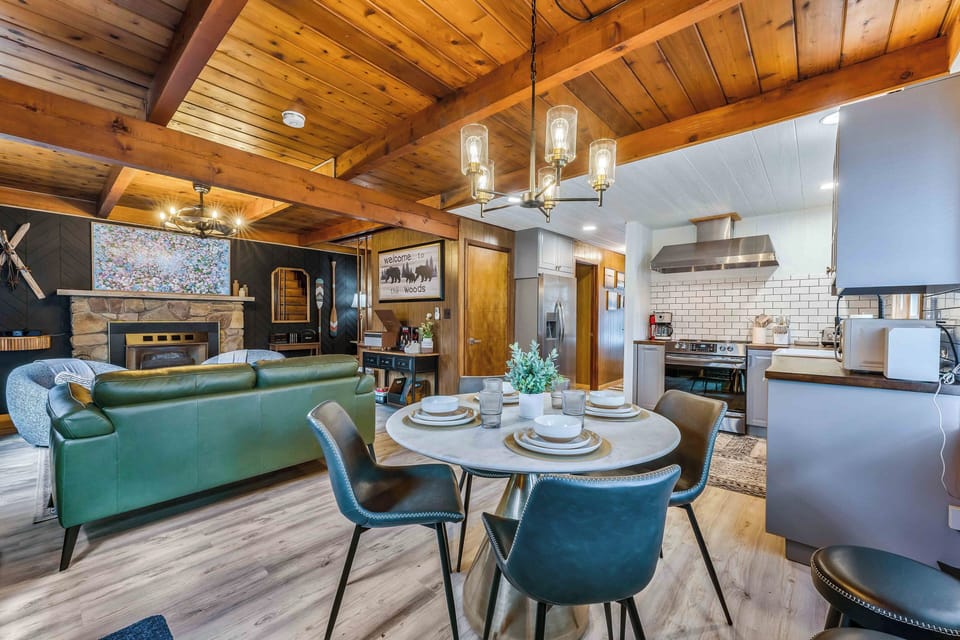 This open-concept space blends a cozy living room, modern kitchen, and sunny dining area - perfect for gathering, relaxing, and sharing meals together